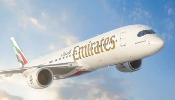 "Dubai skyline with five-star hotels offering free stay for travelers"